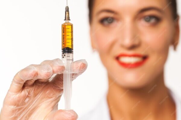 doctor-white-coat-holds-syringe-his-hands